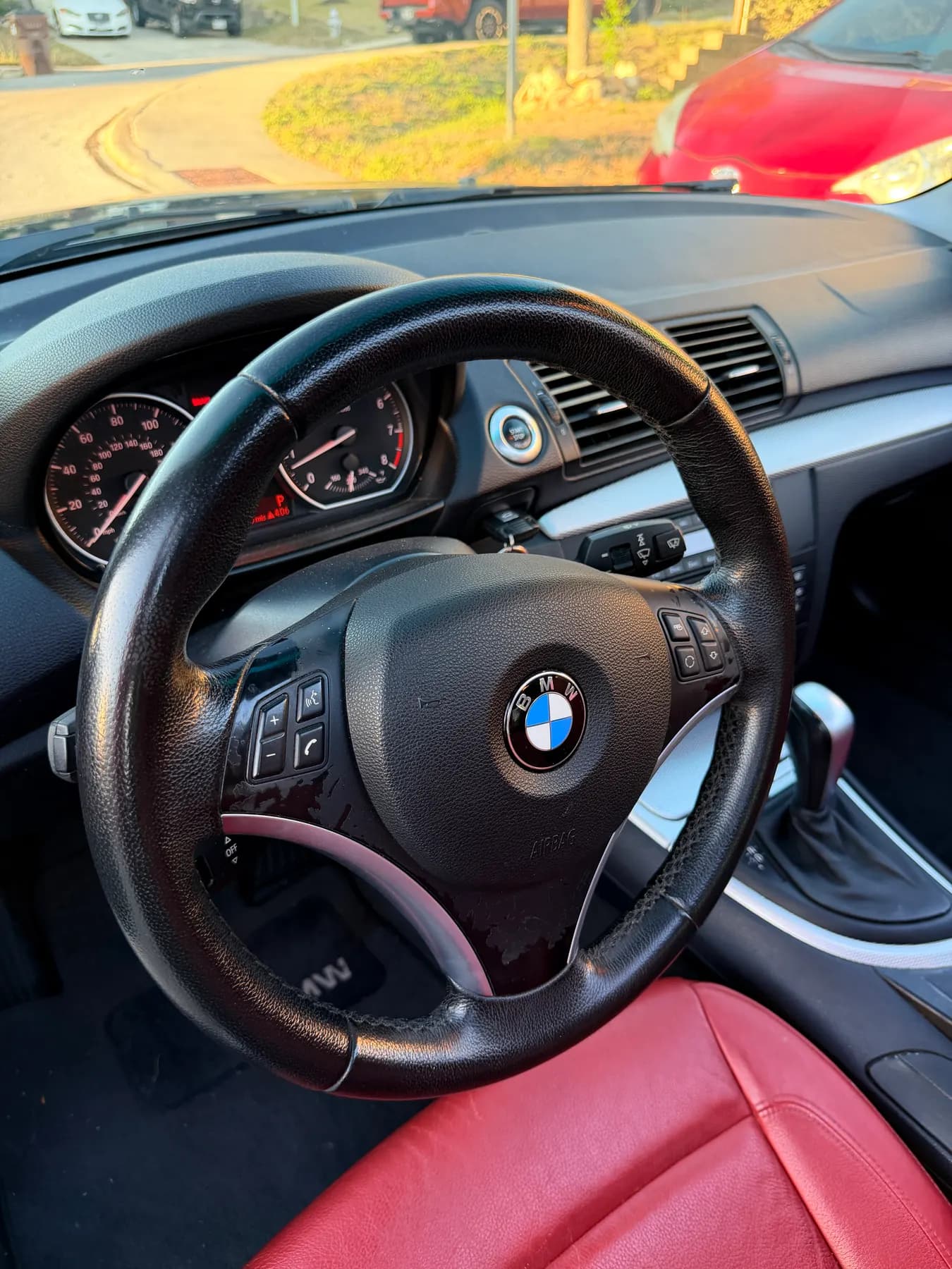 The BMW's steering wheel and instrument cluster, the leather rim cleaned and dressed.