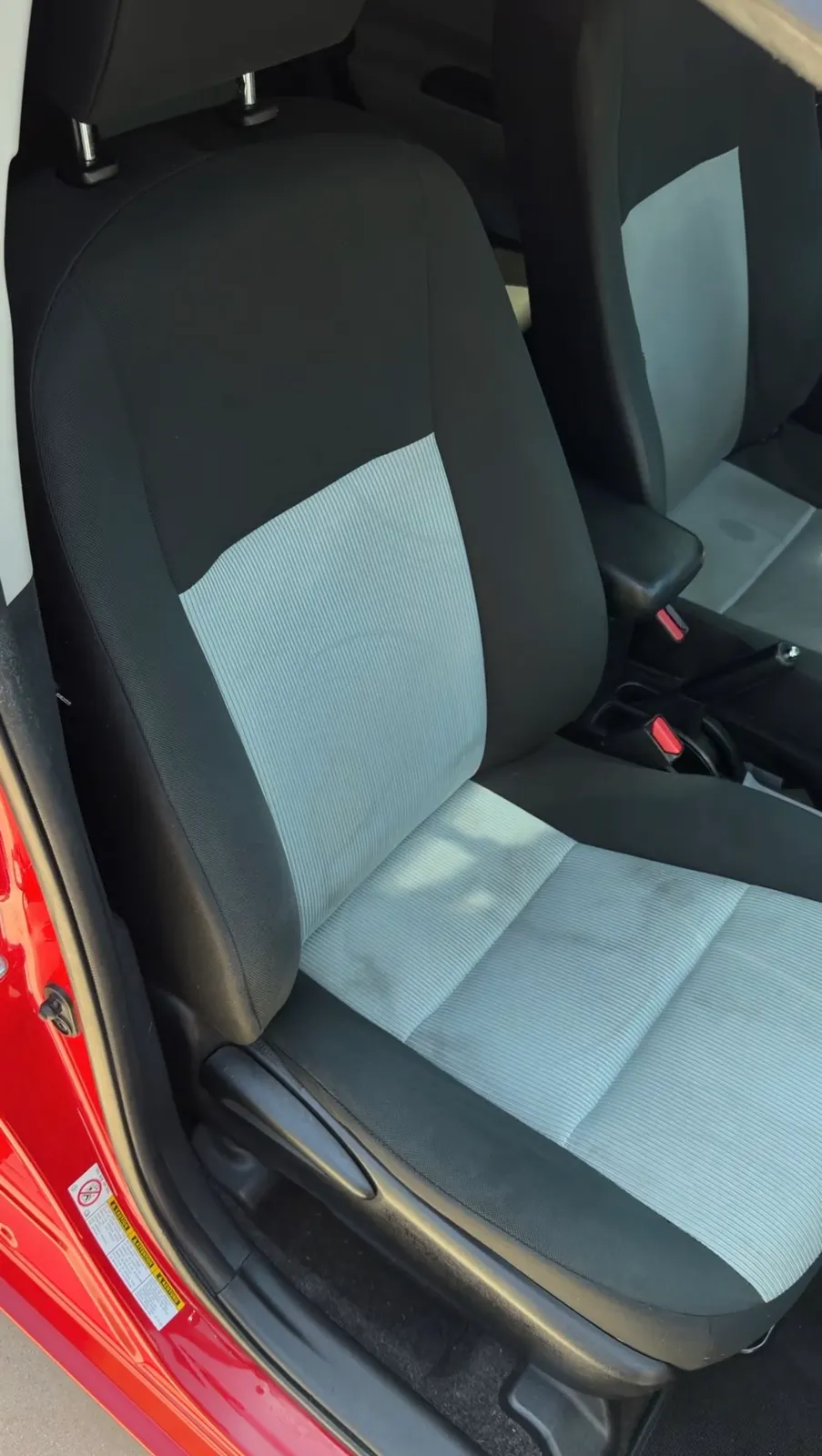 The same Prius seat after cleaning, the cloth back to an even color and the staining lifted.